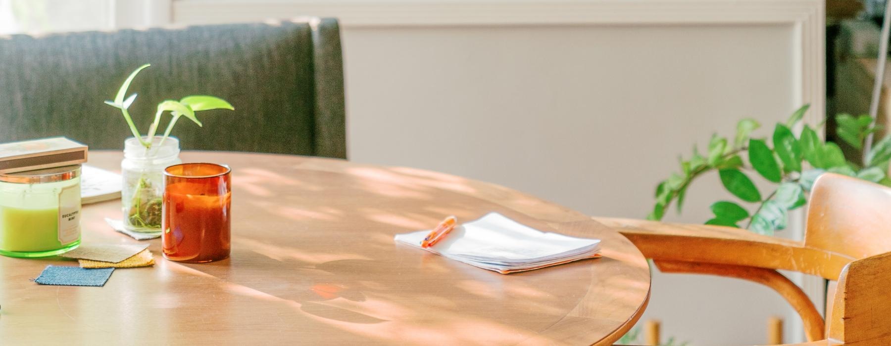 a table with a painting on the wall