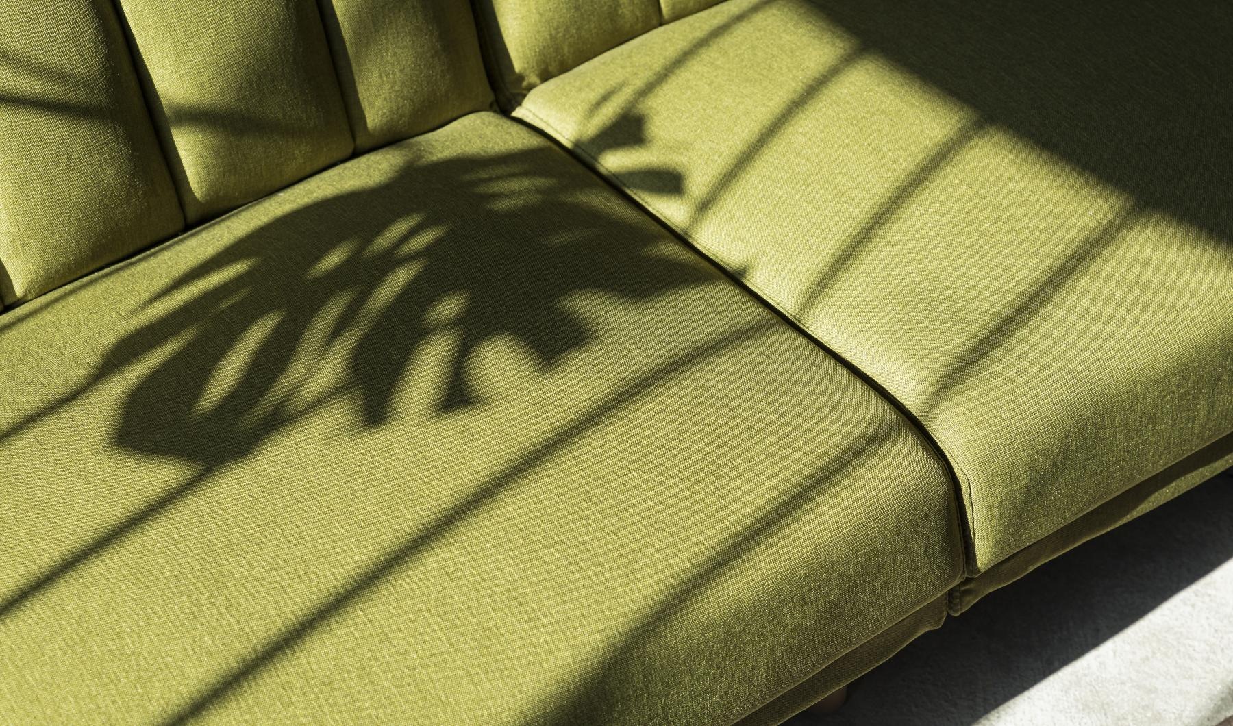 a shadow of a person on a couch